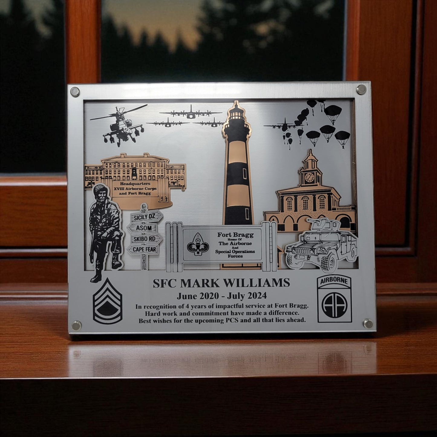 Decorative plaque with military-themed elements and text on a wooden surface. Fort Bragg, Army PCS Gift for Fort Bragg, Fort Liberty PCS Gift