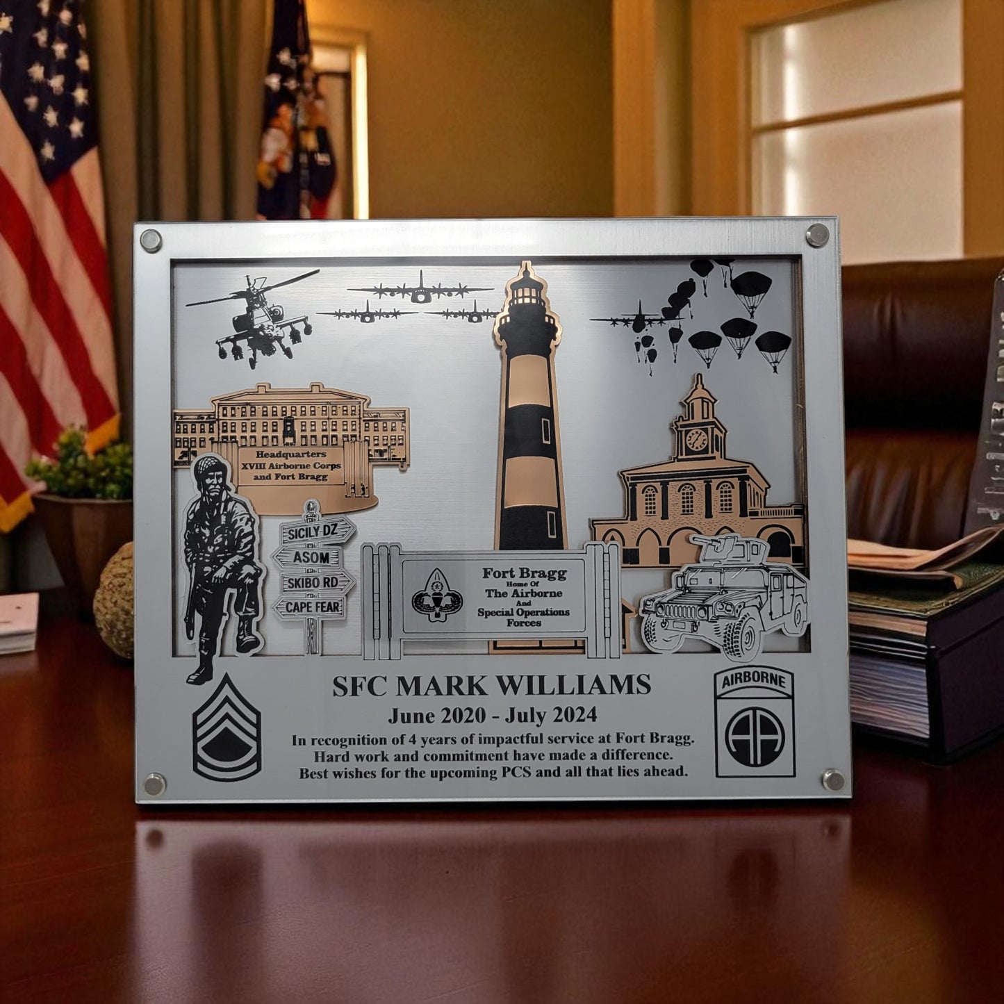 Decorative plaque with military-themed elements and text on a wooden surface. Fort Bragg, Army PCS Gift for Fort Bragg, Fort Liberty PCS Gift