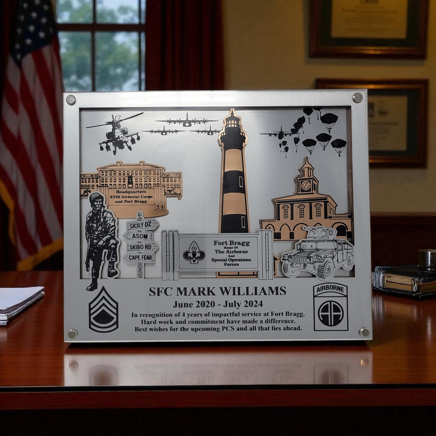 Decorative plaque with military-themed elements and text on a wooden surface. Fort Bragg, Army PCS Gift for Fort Bragg, Fort Liberty PCS Gift