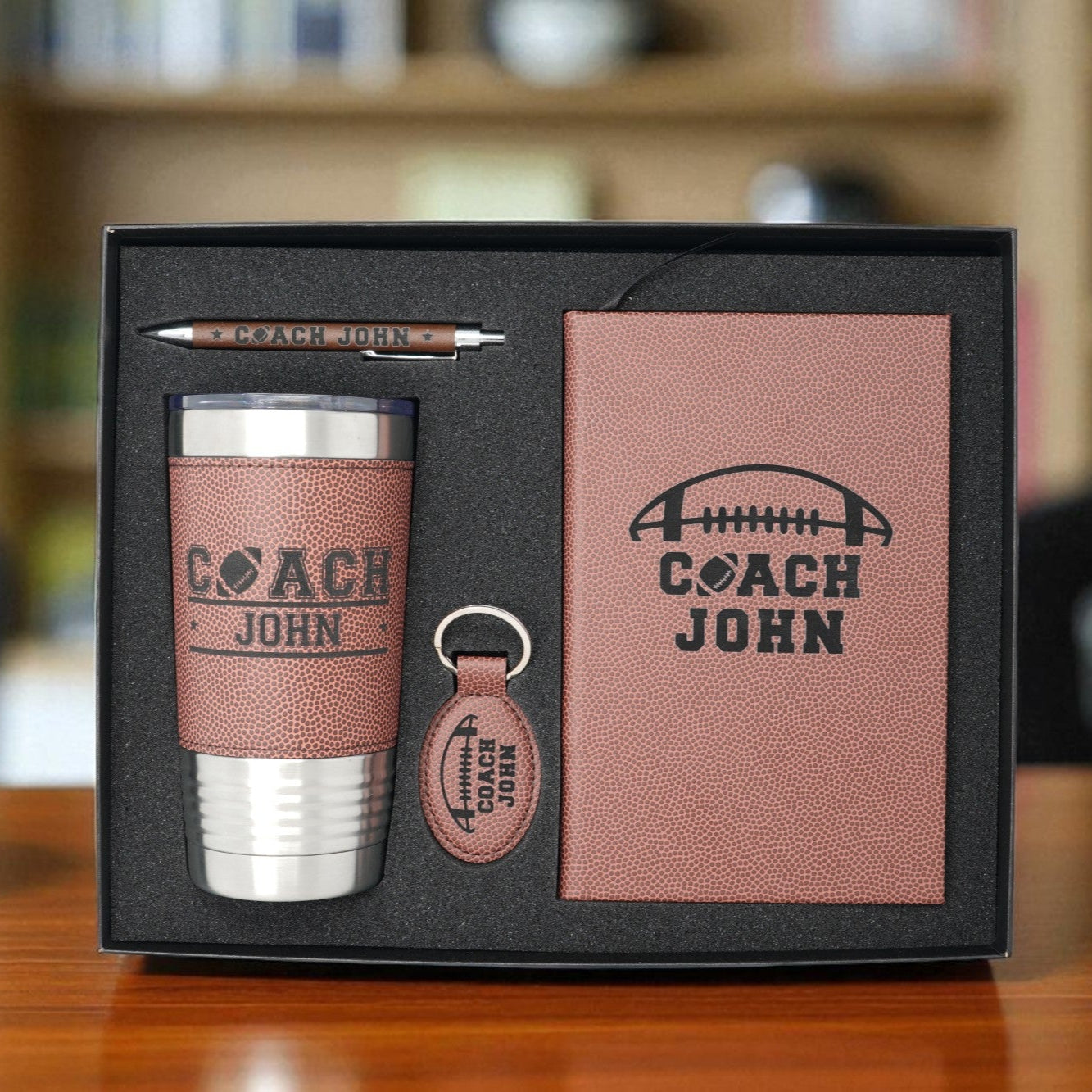 Gift set with tumbler, keychain, and card in a box, featuring 'Coach John' branding.