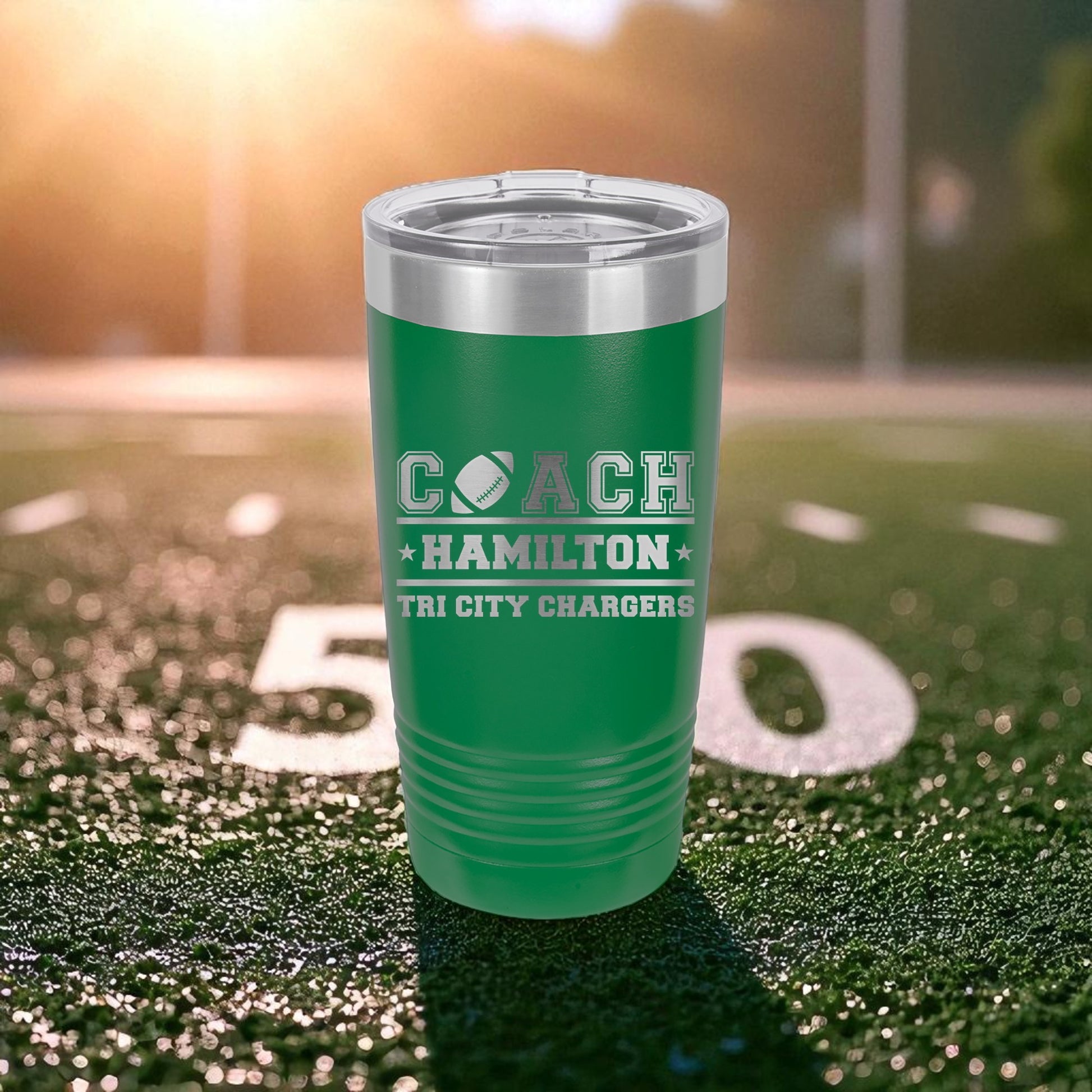 Green tumbler with 'Coach Hamilton' and 'City Chargers' text on a sports field background