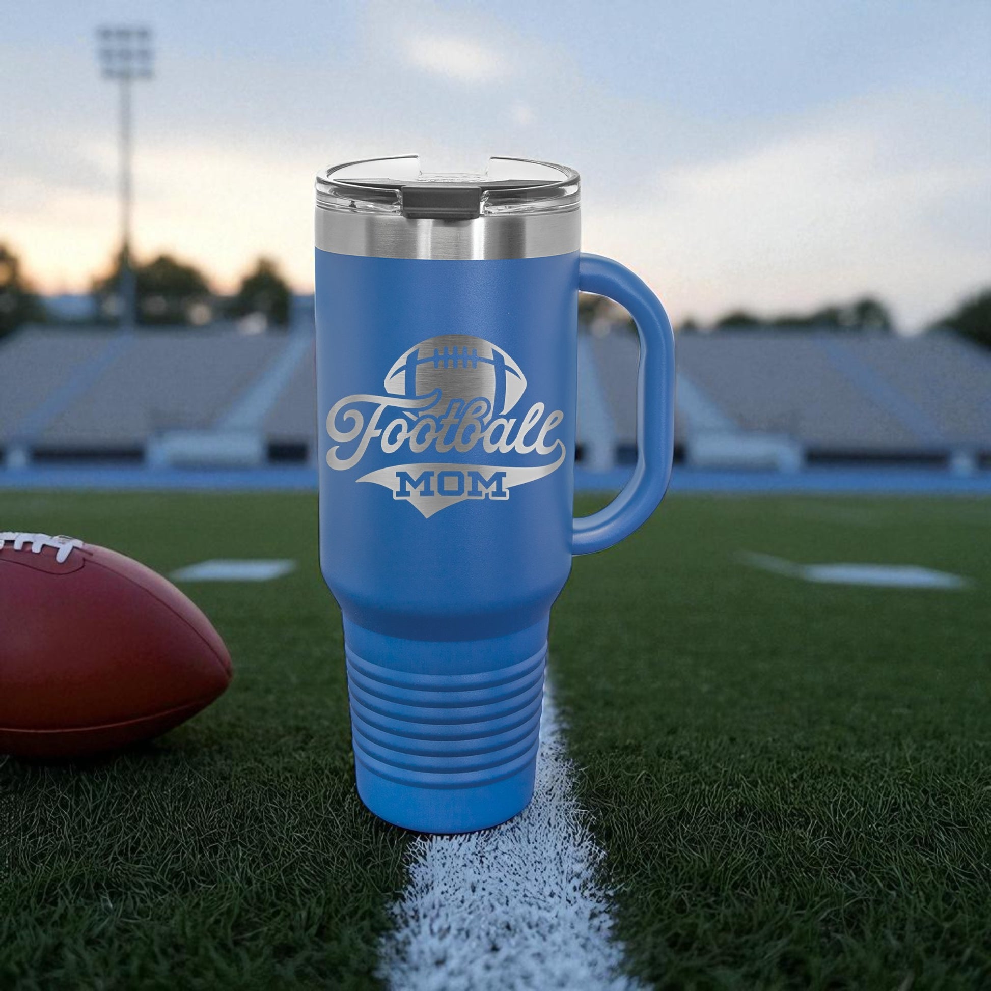 Blue mug with 'Football Mom' text on a football field