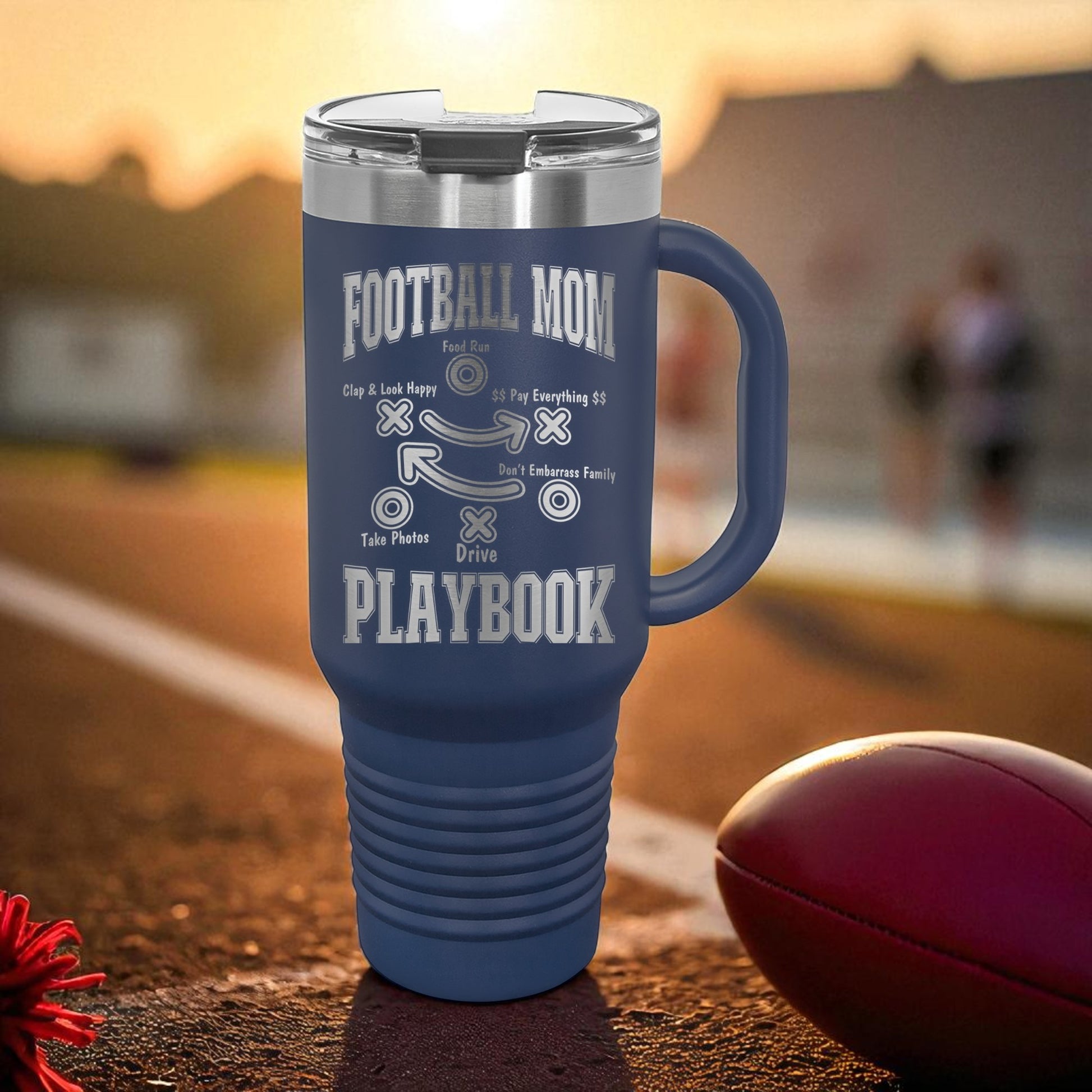 Blue travel mug with 'Football Mom' text on a sports field background