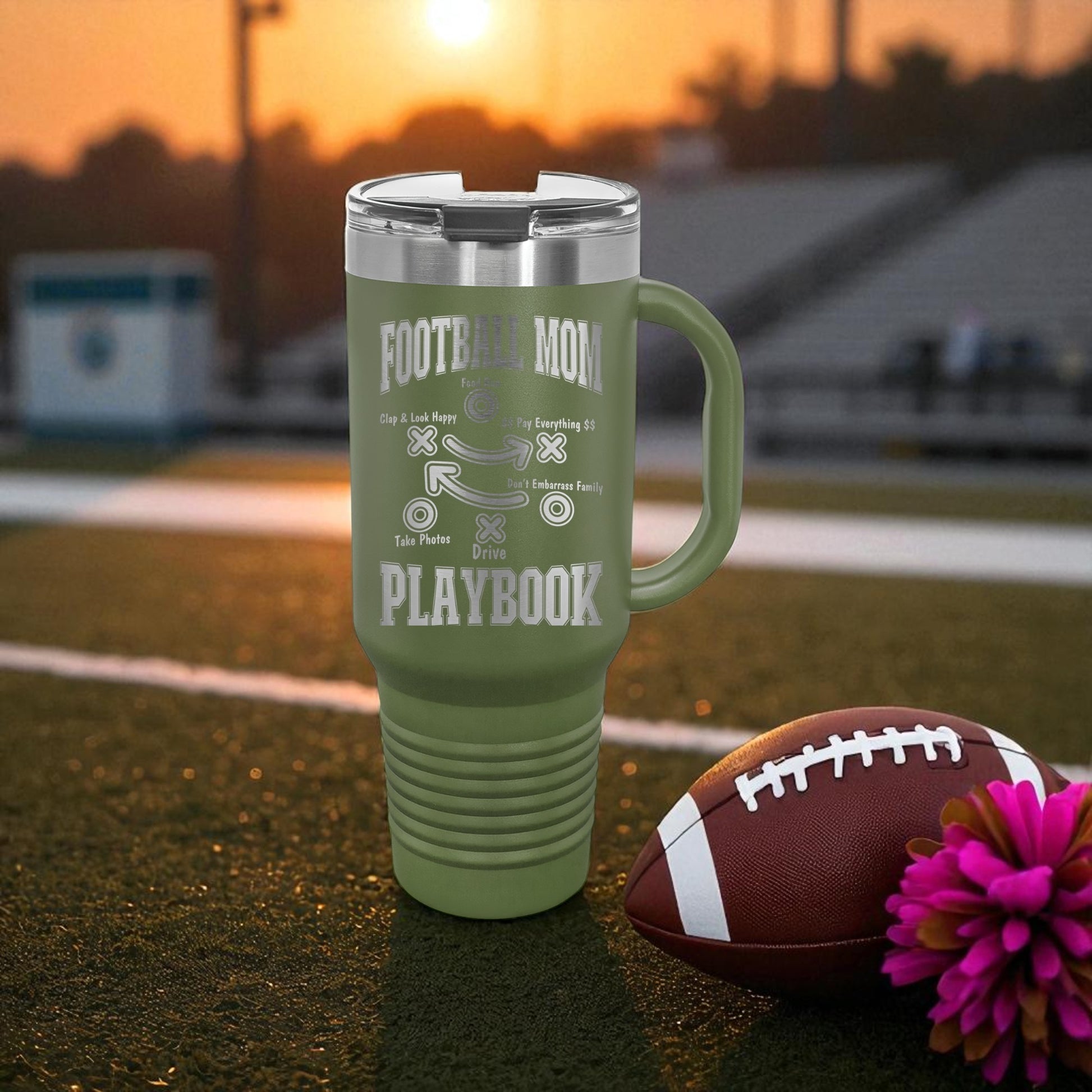 Football Mom Playbook 40oz Stanley Tumbler with Handle — laser-etched stainless steel travel mug made for Friday Night Lights, tailgates, and long tournament days. The Football Mom “Playbook” design is permanently engraved (not printed) so it won’t peel, crack, or fade. Perfect team mom gift, booster club gift, senior night gift, and everyday car cup for busy sports moms.