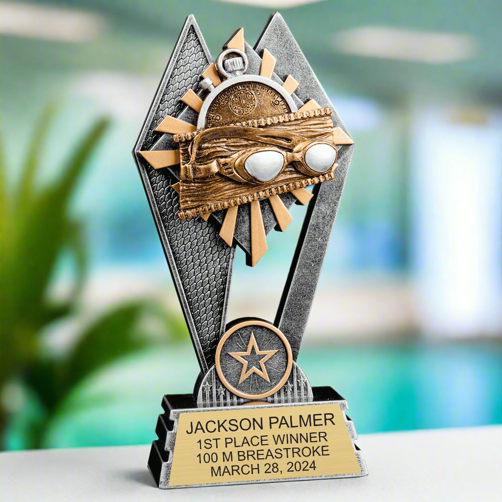 Front view of the 7-inch Swimming Sun Ray Award trophy, showing its silver and gold finish, dual-peak design, and wave-themed emblem
