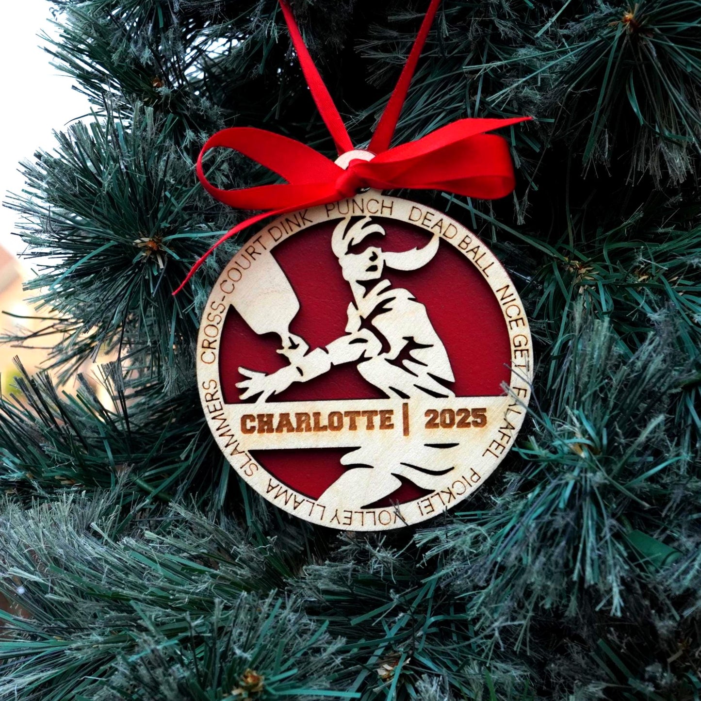 Decorative ornament with a red ribbon on a Christmas tree Pickleball Ornament