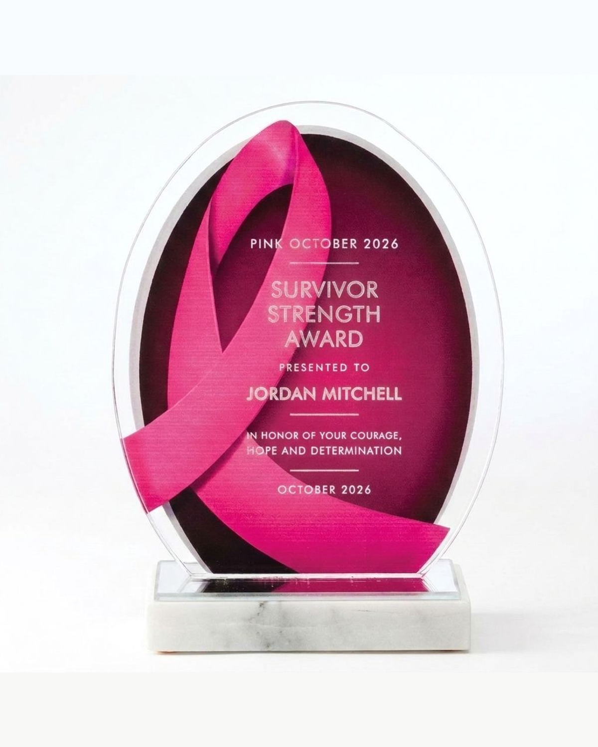 Personalized breast cancer awareness acrylic award, pink ribbon oval plaque engraved in frosted white for a Survivor Strength Award, on a white marble base, October pink-out gift