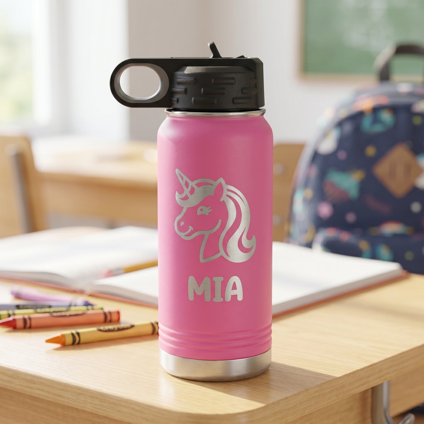 Pink personalized kids water bottle with engraved unicorn design and name
