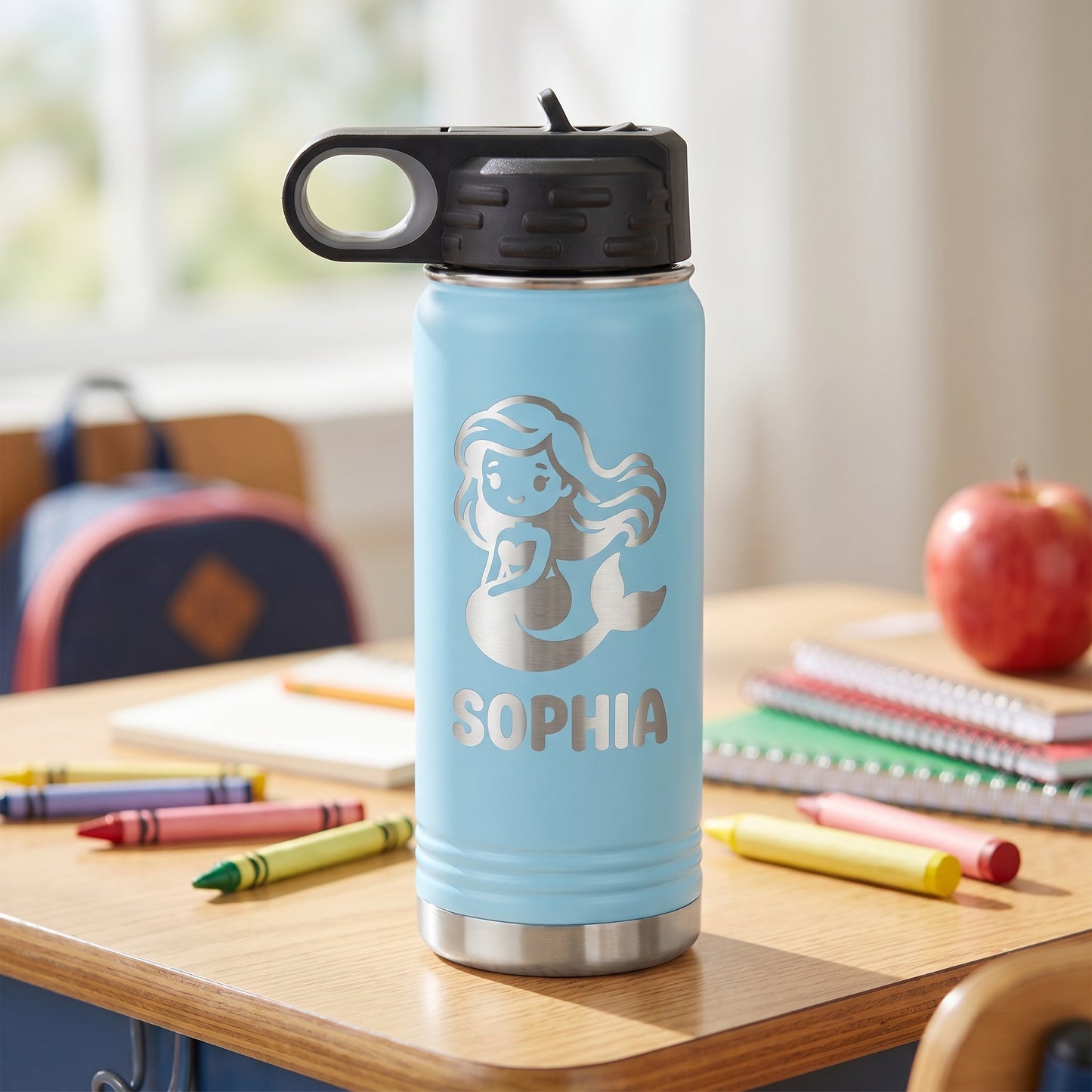 Light blue personalized kids water bottle with engraved mermaid design and name