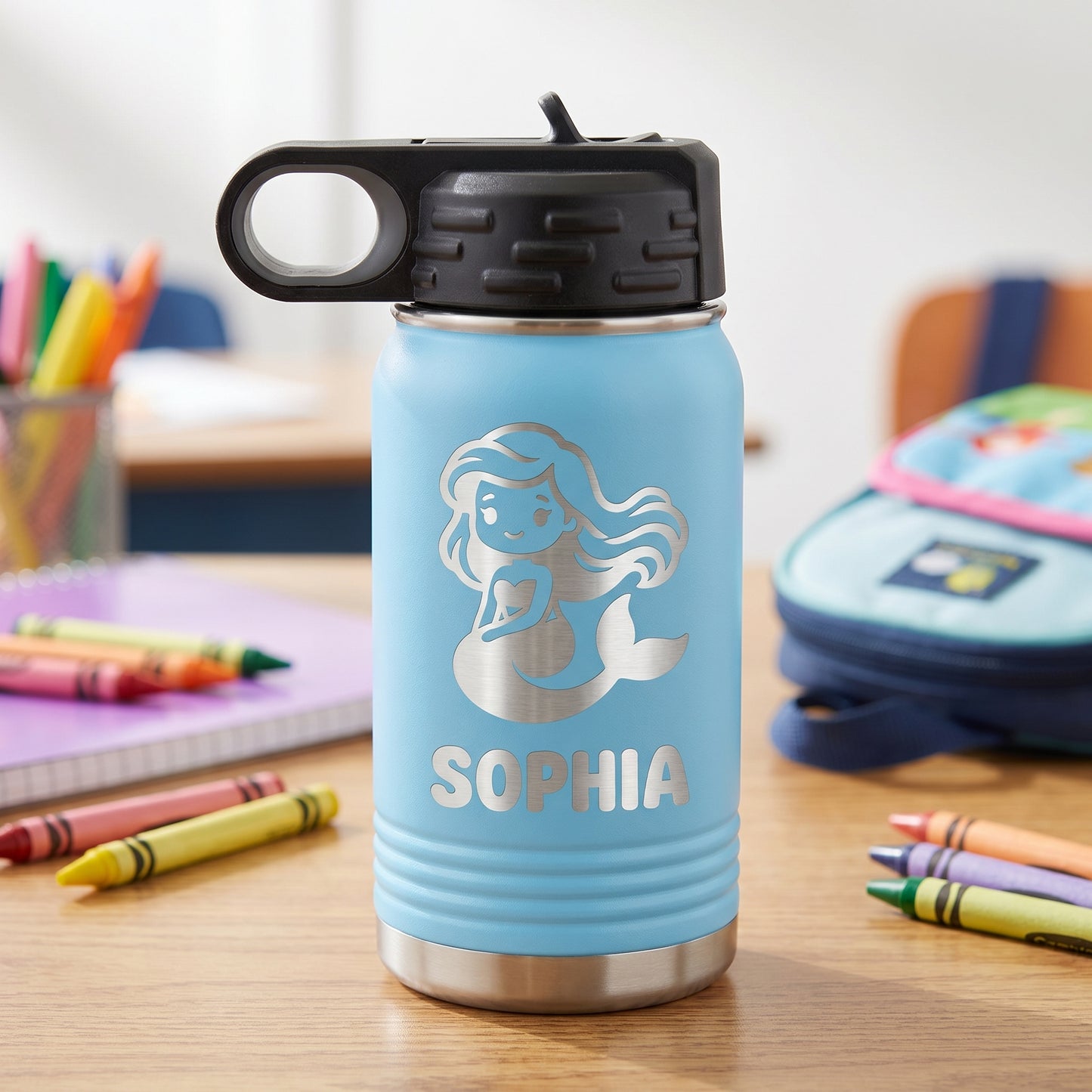 Light blue personalized kids 12oz water bottle with engraved mermaid design and name