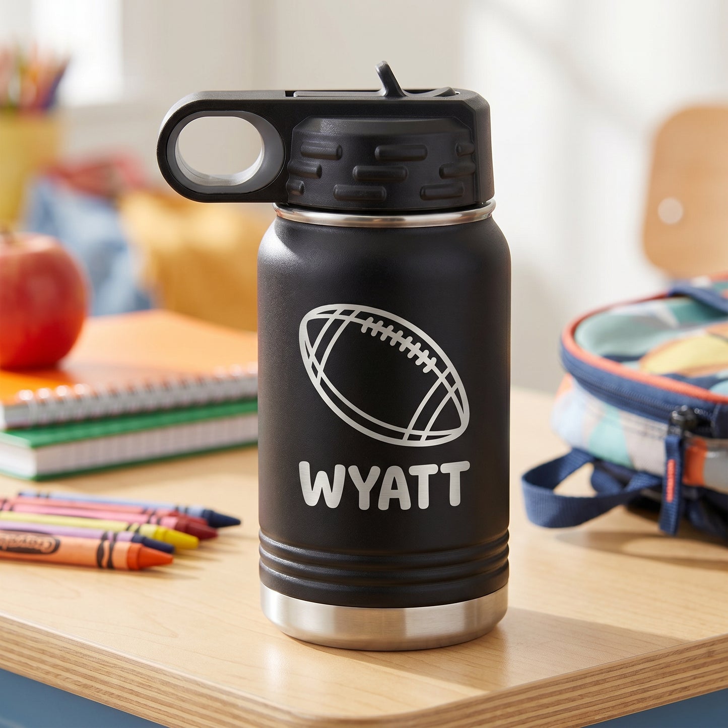 Black personalized kids 12oz water bottle with engraved football design and name