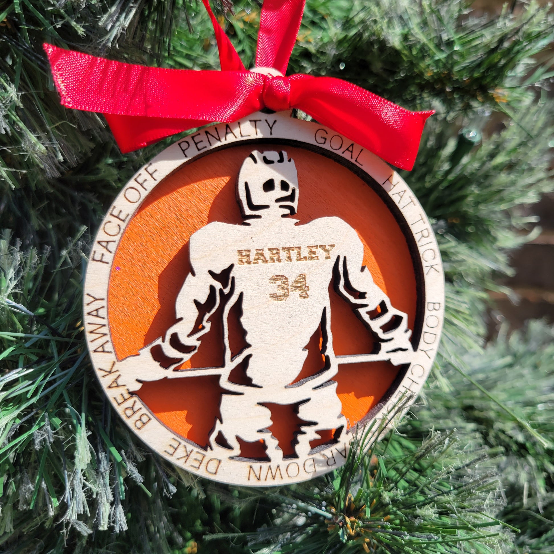 Decorative ornament with a red ribbon on a Christmas tree Decorative Christmas ornament with a hockey player, personalized hockey player ornament, custom wooden hockey player ornament, hockey player ornament, christmas gift for hockey player