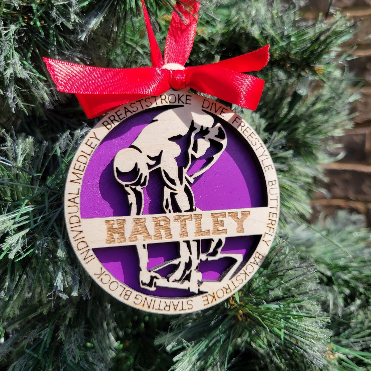 Decorative ornament with a red ribbon on a green background, swimmer gift, swimming ornament, freestyle swimmer gift, christmas ornament for swimmer