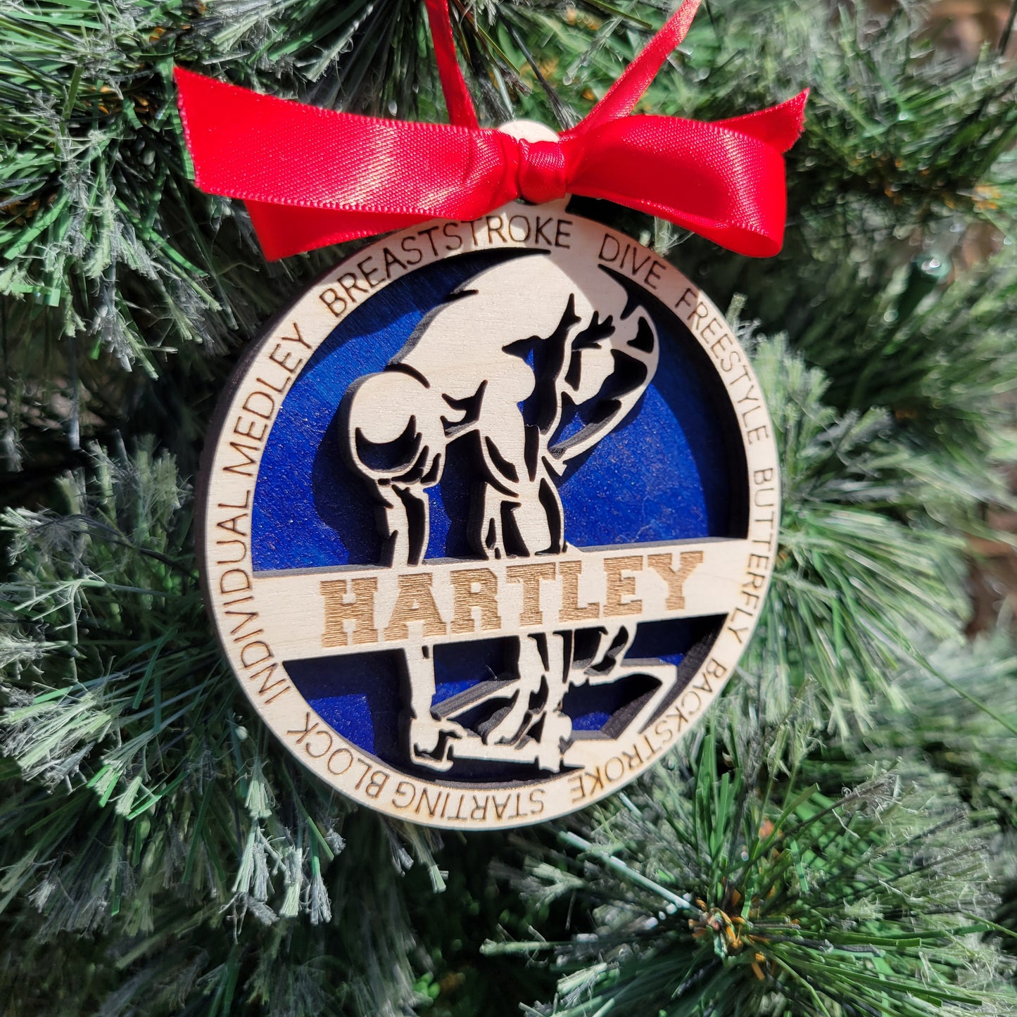 Decorative ornament with a red ribbon on a green background, swimmer gift, swimming ornament, freestyle swimmer gift, christmas ornament for swimmer