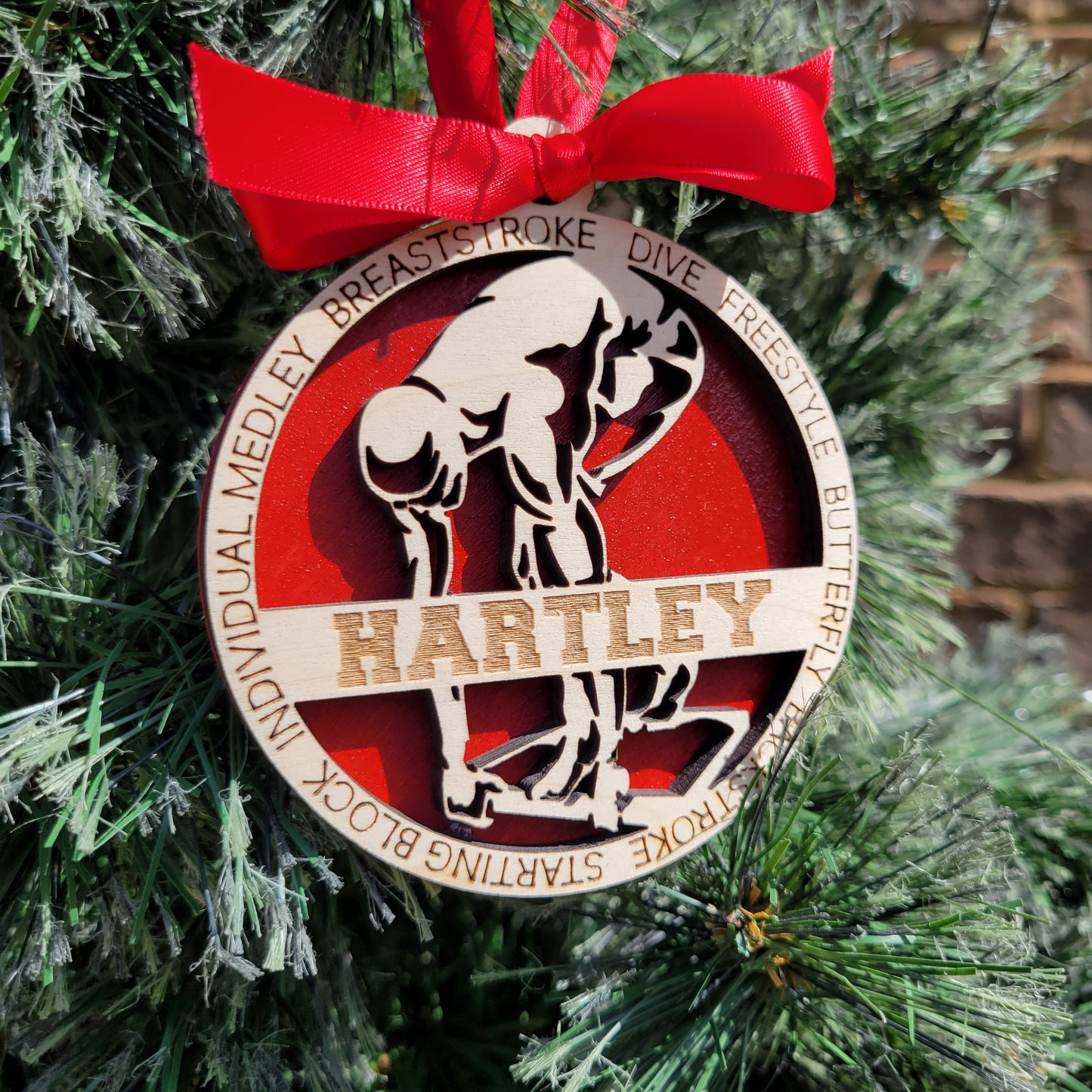 Decorative ornament with a red ribbon on a green background, swimmer gift, swimming ornament, freestyle swimmer gift, christmas ornament for swimmer