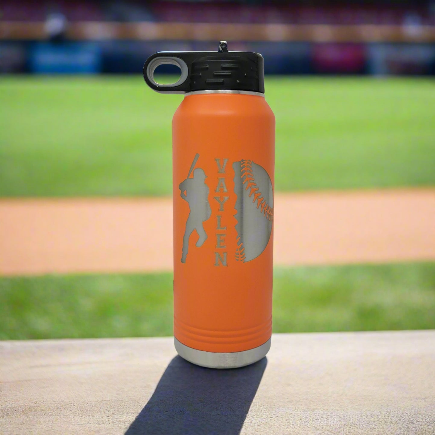 Personalized baseball water bottle, orange with a baseball field in the background