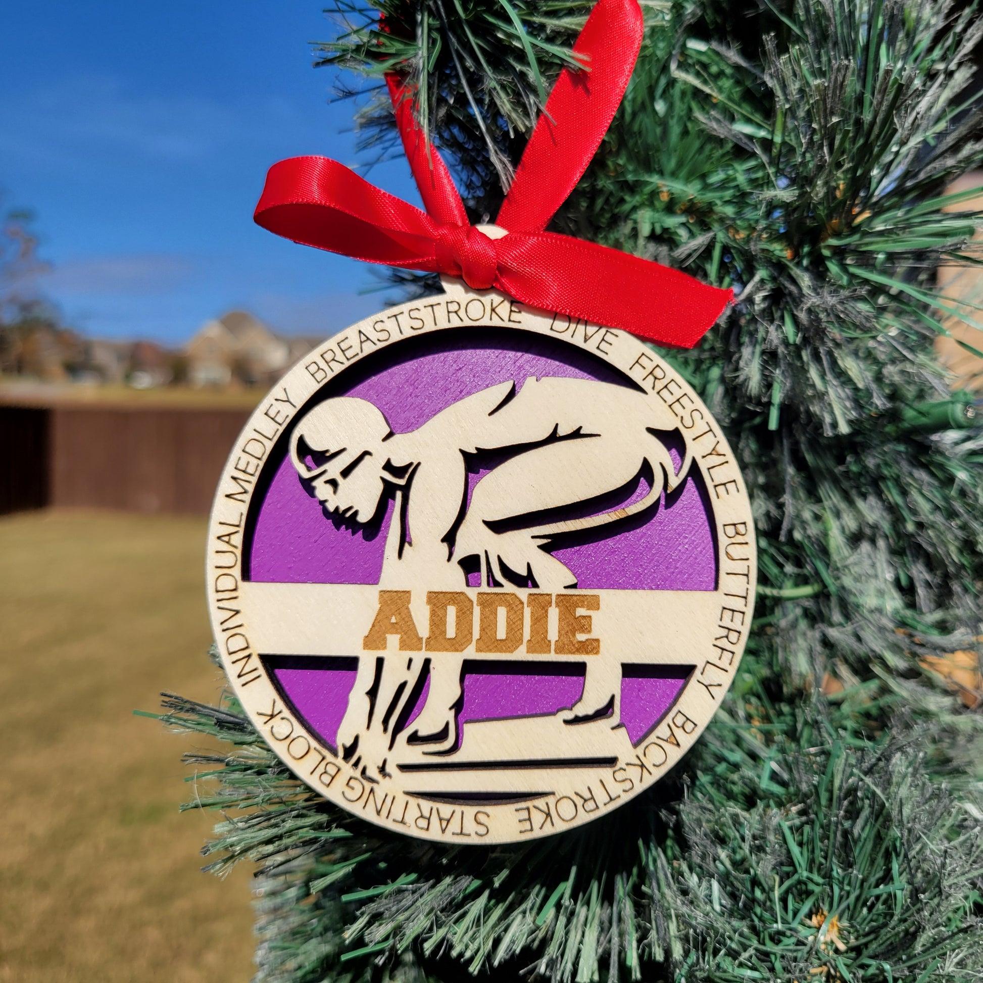 Decorative ornament with a red ribbon on a green background, swimmer gift, swimming ornament, freestyle swimmer gift, christmas ornament for swimmer