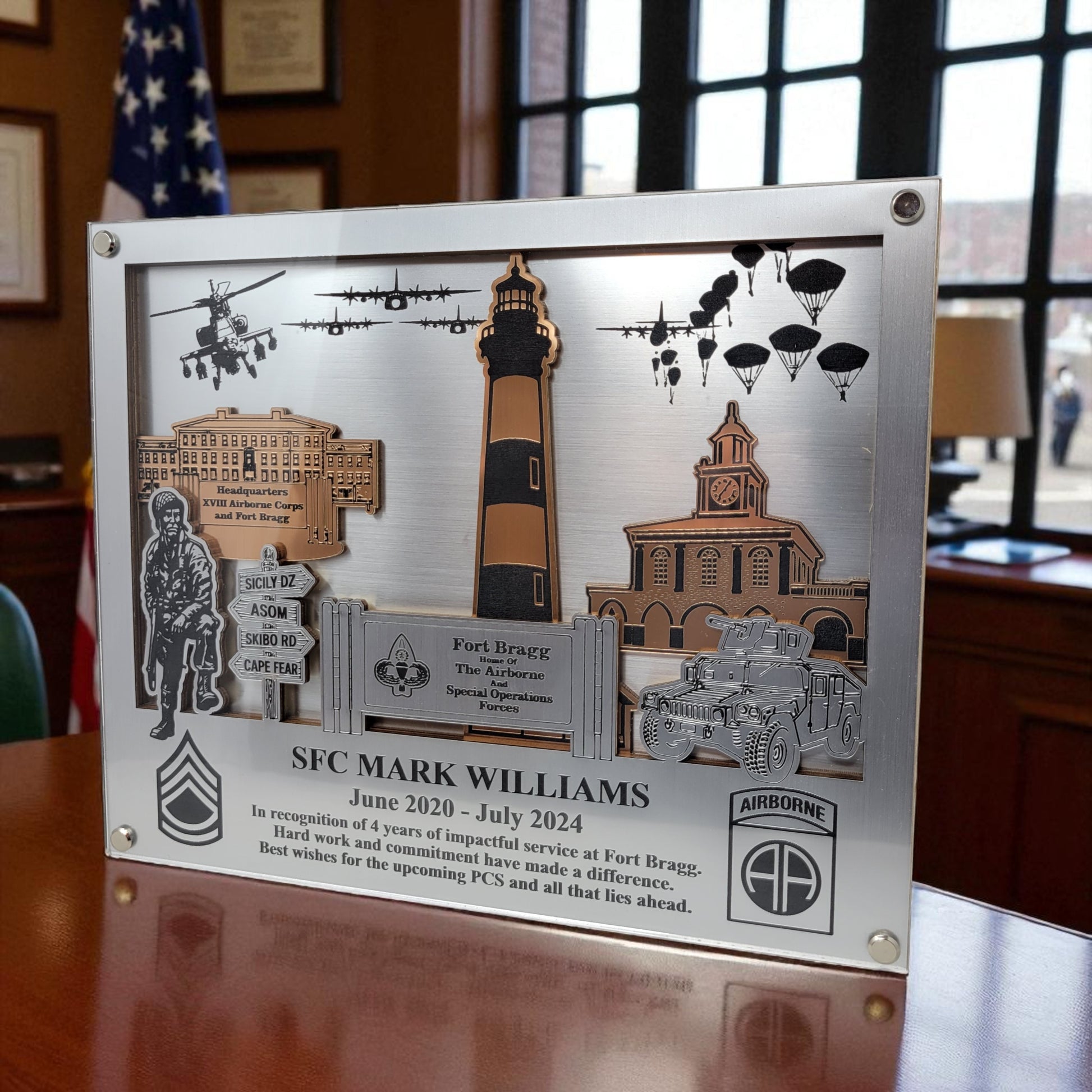 Decorative plaque with military-themed elements and text on a wooden surface. Fort Bragg,  Army PCS Gift for Fort Bragg, Fort Liberty PCS Gift