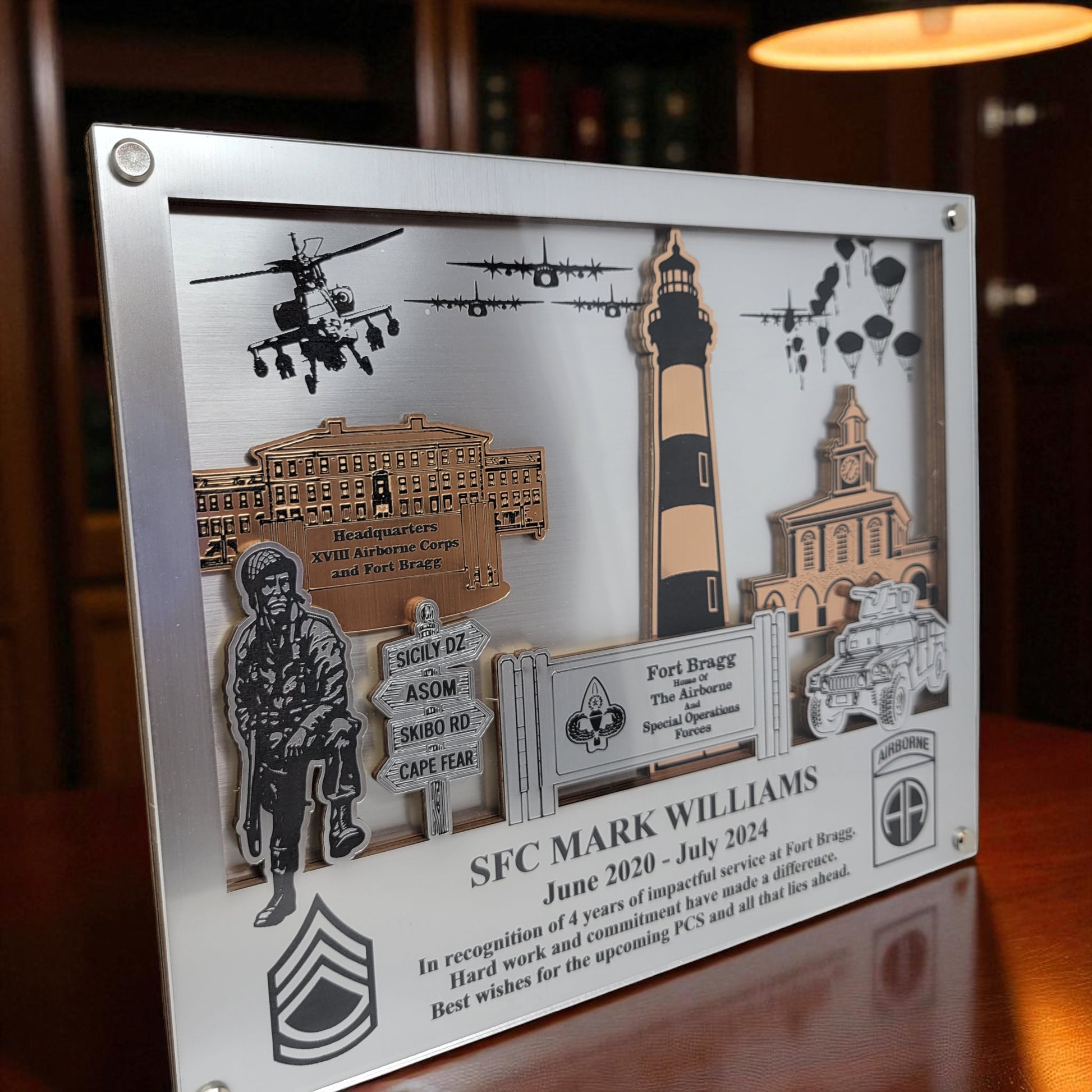 Decorative plaque with military-themed elements and text on a wooden surface. Fort Bragg,  Army PCS Gift for Fort Bragg, Fort Liberty PCS Gift