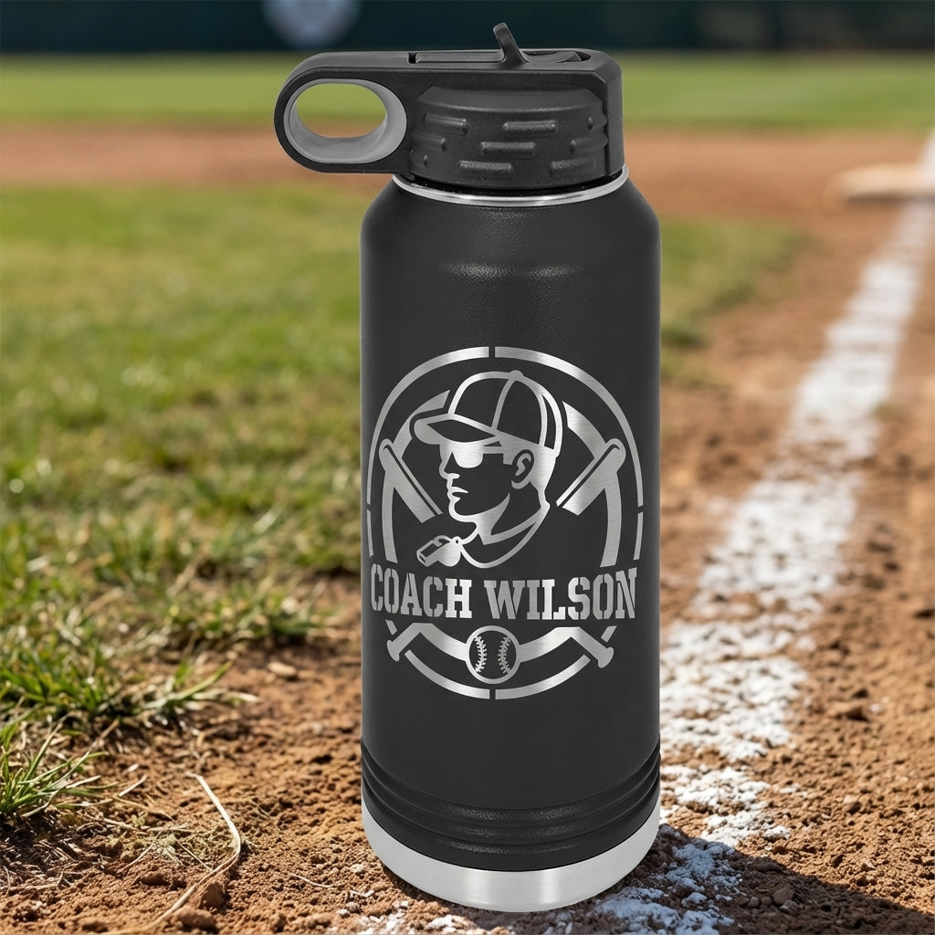 Black water bottle with 'Coach Wilson' logo on a baseball field