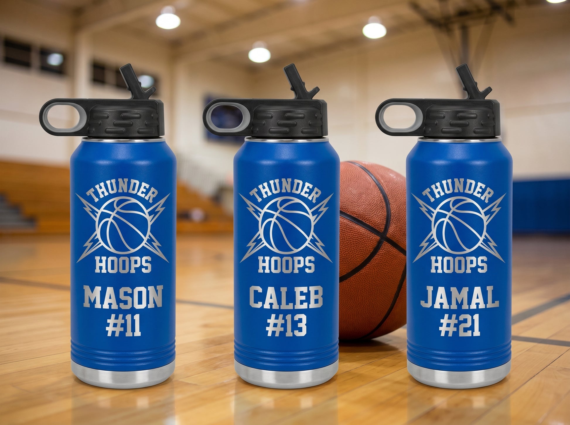 three royal blue basketball water bottles thunder hoops team crest player names lined up gym