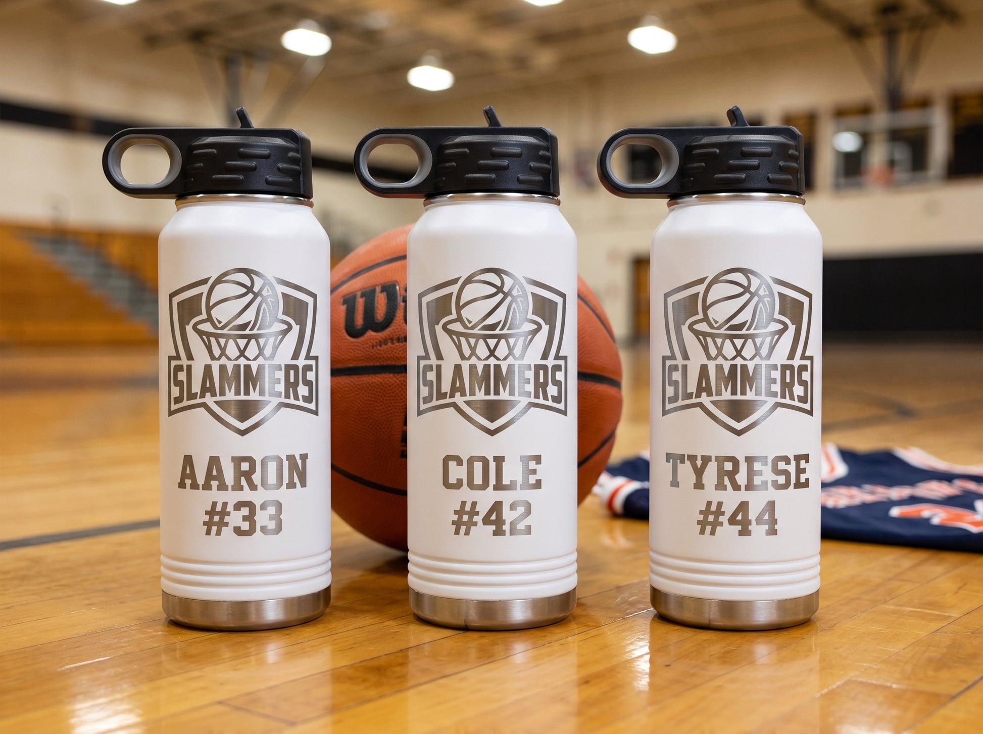 three white basketball team water bottles slammers logo personalized player names numbers team