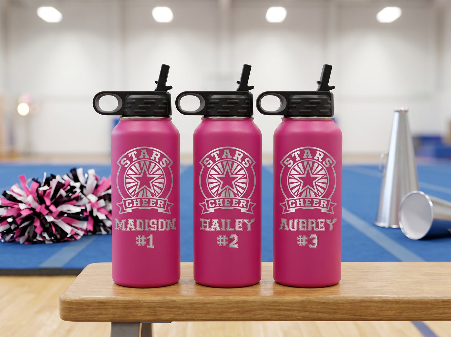 three hot pink cheer team water bottles personalized with cheerleader names and numbers