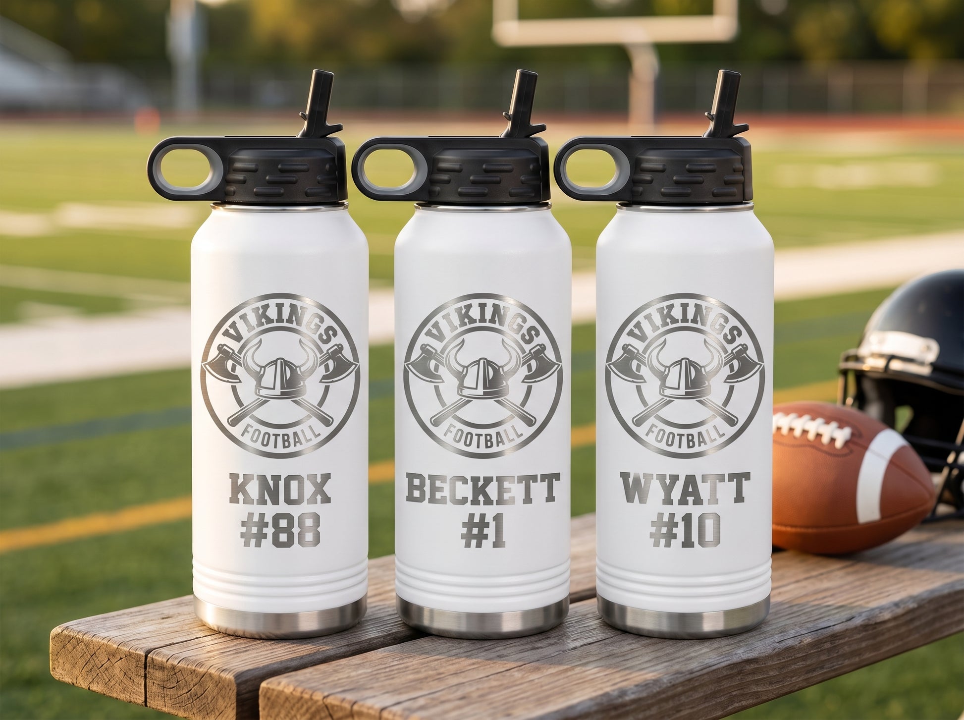 three white football team water bottles personalized with vikings team logo and player names