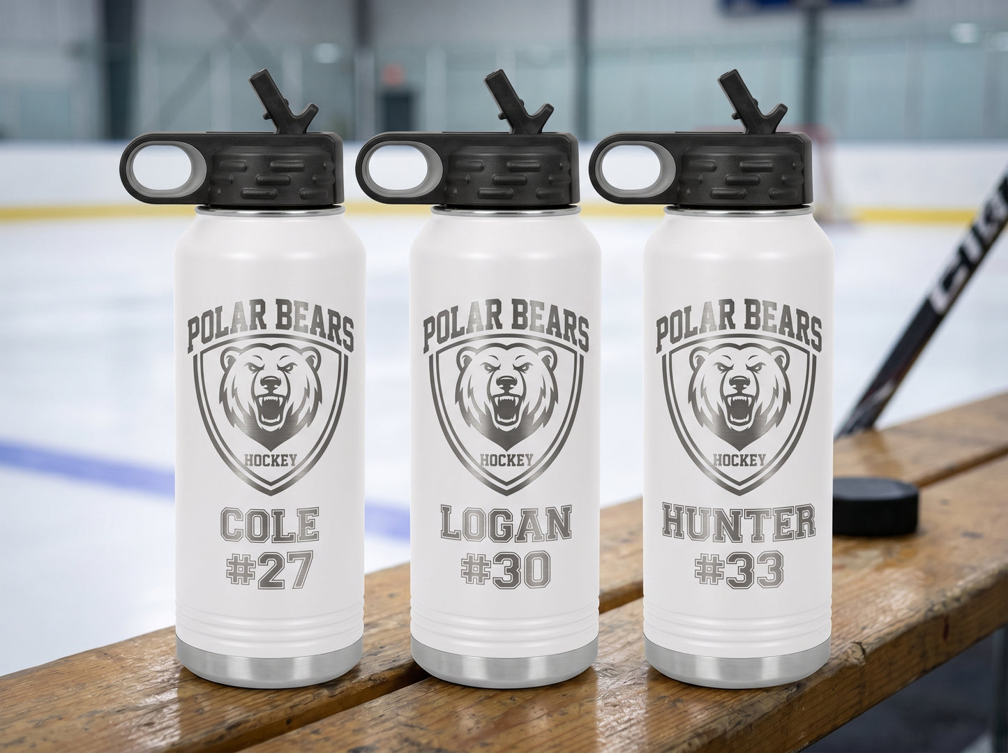 three white hockey team water bottles personalized with player names and numbers for team roster