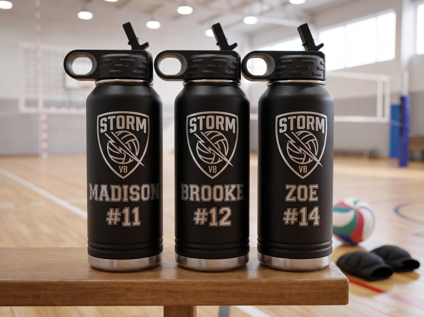 three black volleyball team water bottles with team crest and individual player jersey numbers