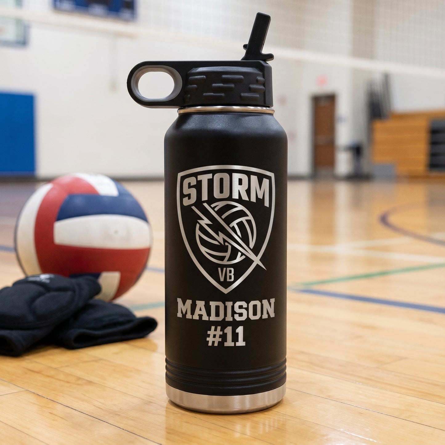 black 32oz engraved volleyball water bottle with team crest and player name