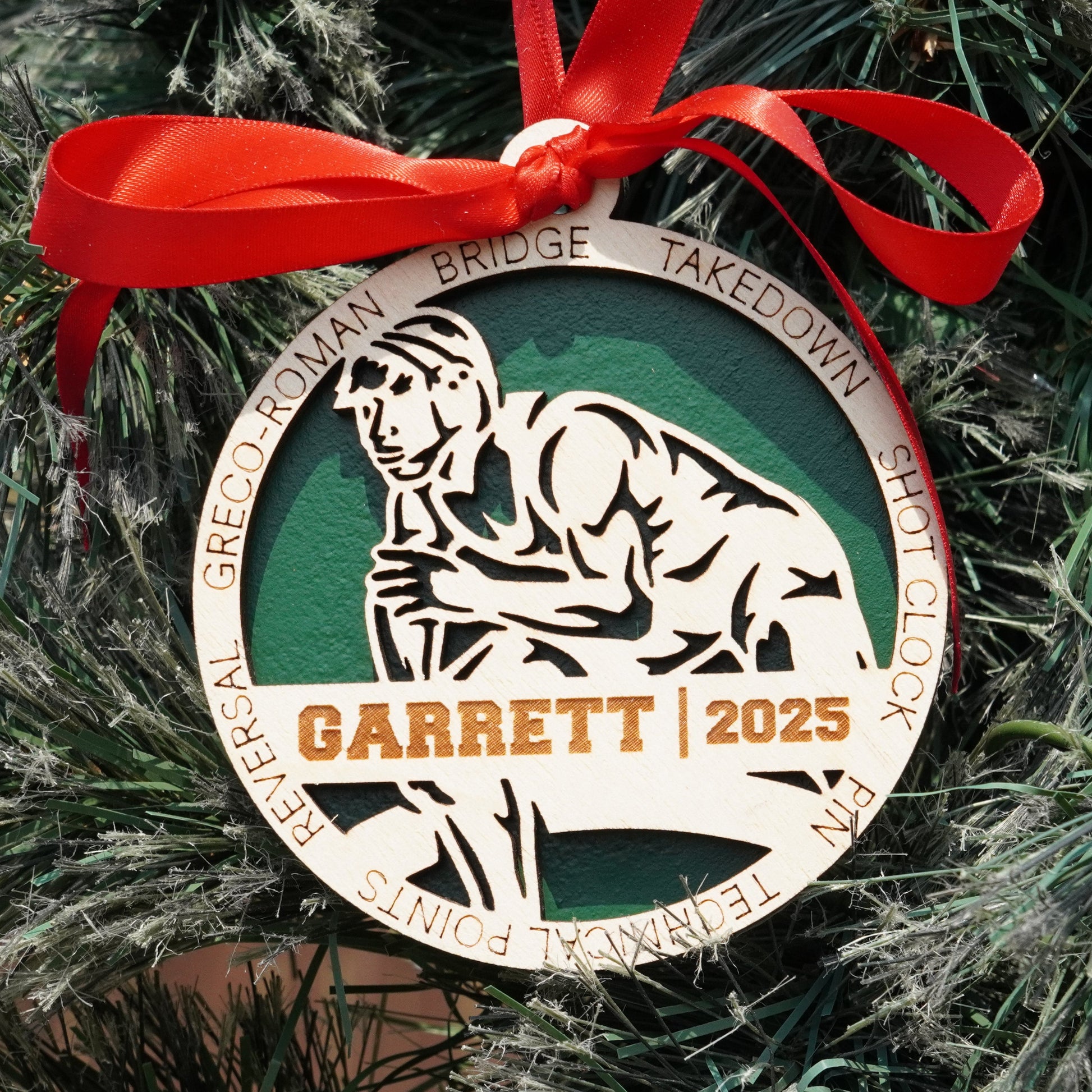 Garrett 2023 Christmas ornament on a tree with a red ribbon Decorative ornament with a red ribbon on a Christmas tree, featuring a wrestler, wrestling ornament, christmas gift for wrestler, wrestling ornament,
