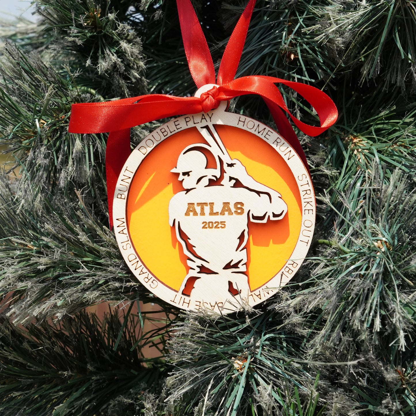 Decorative ornament with a red ribbon on a Christmas tree