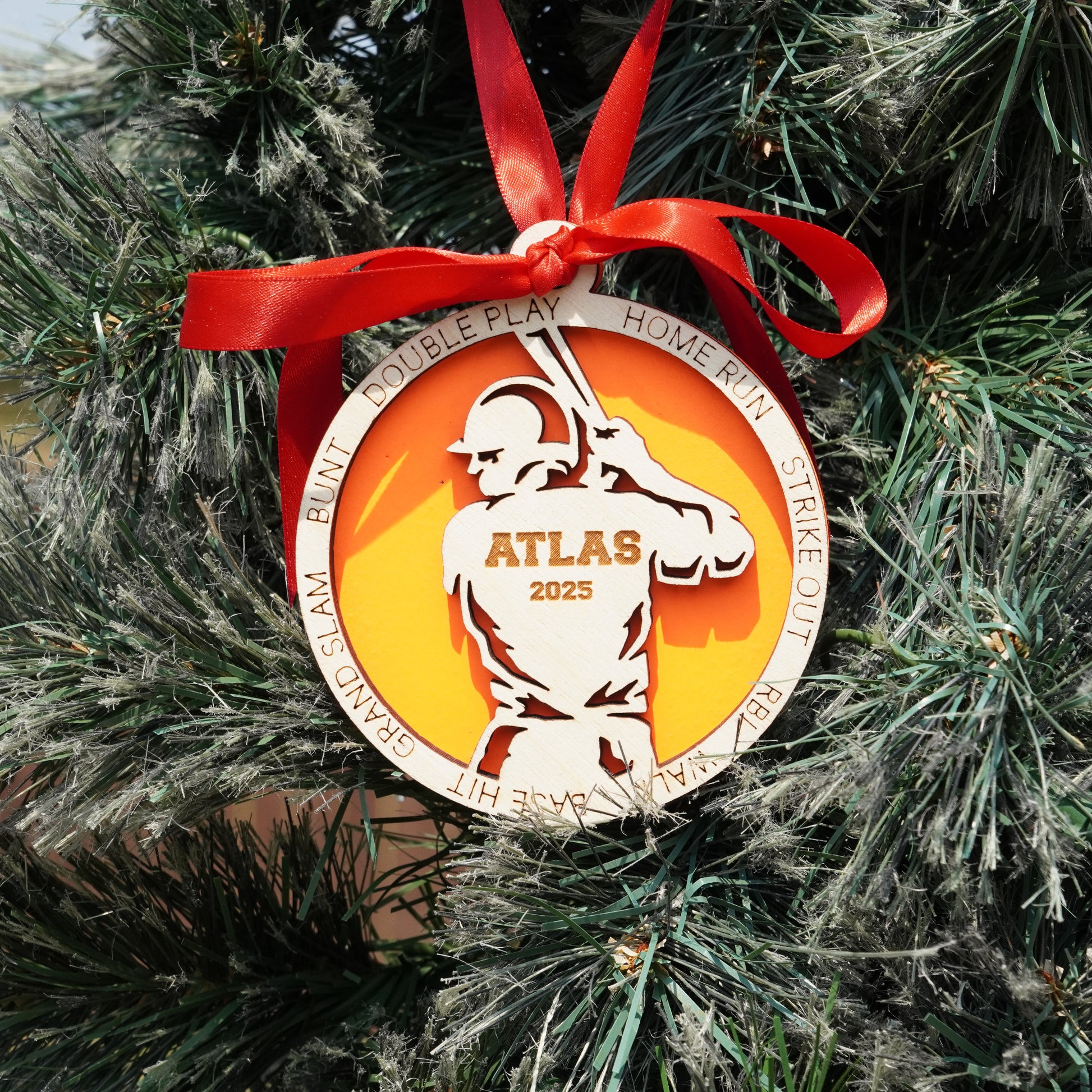 Decorative ornament with a red ribbon on a Christmas tree