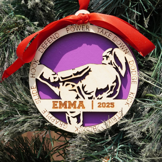 Decorative ornament with a purple circle and white horse silhouette, hanging on a Christmas tree.