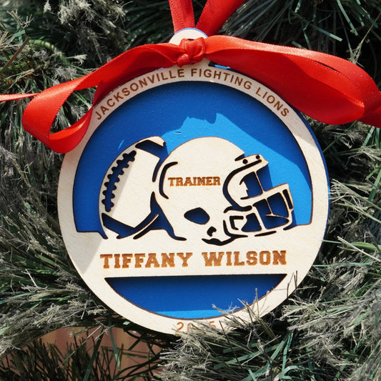 Ornament with a football helmet design on a Christmas tree