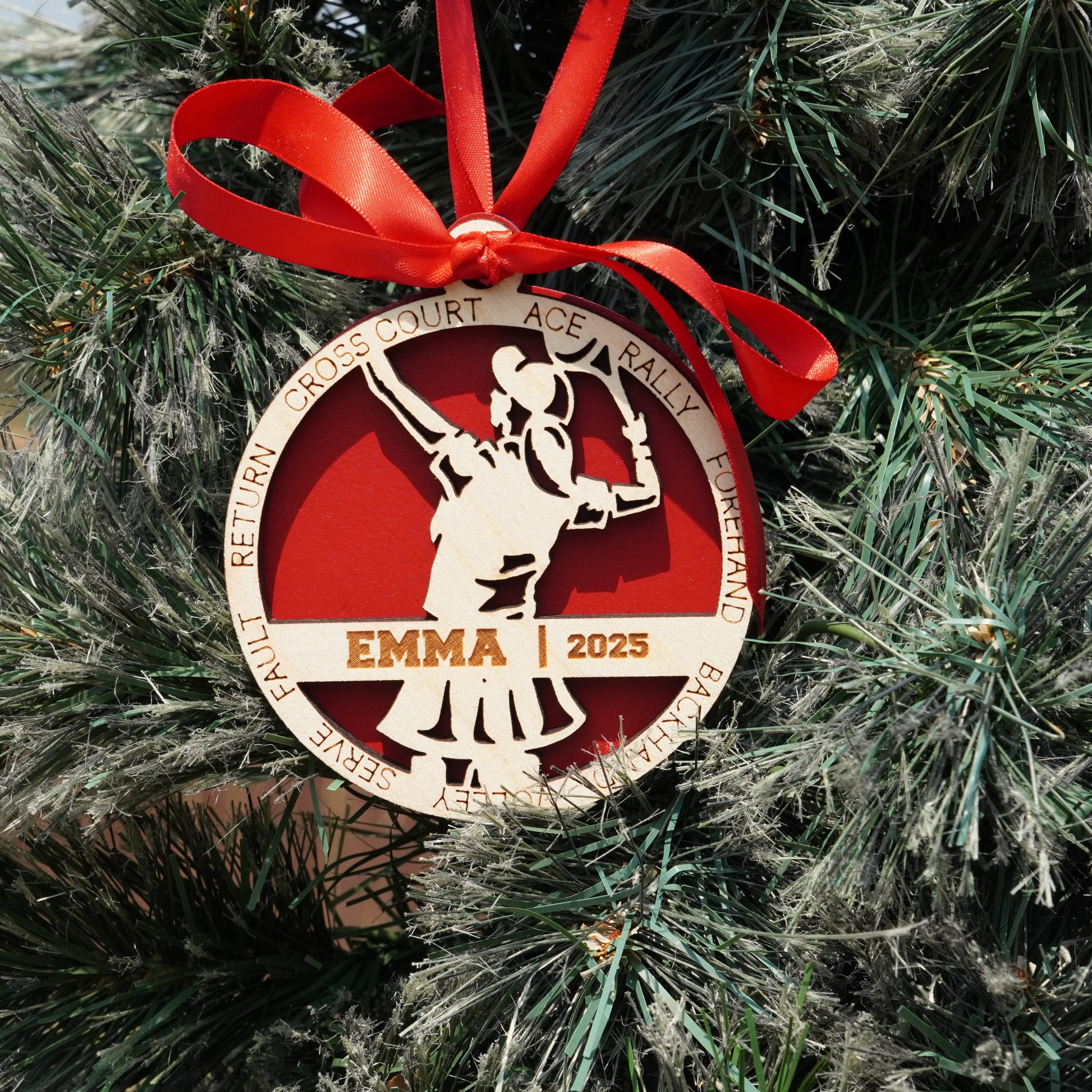 Decorative Christmas ornament with a red ribbon on a tree