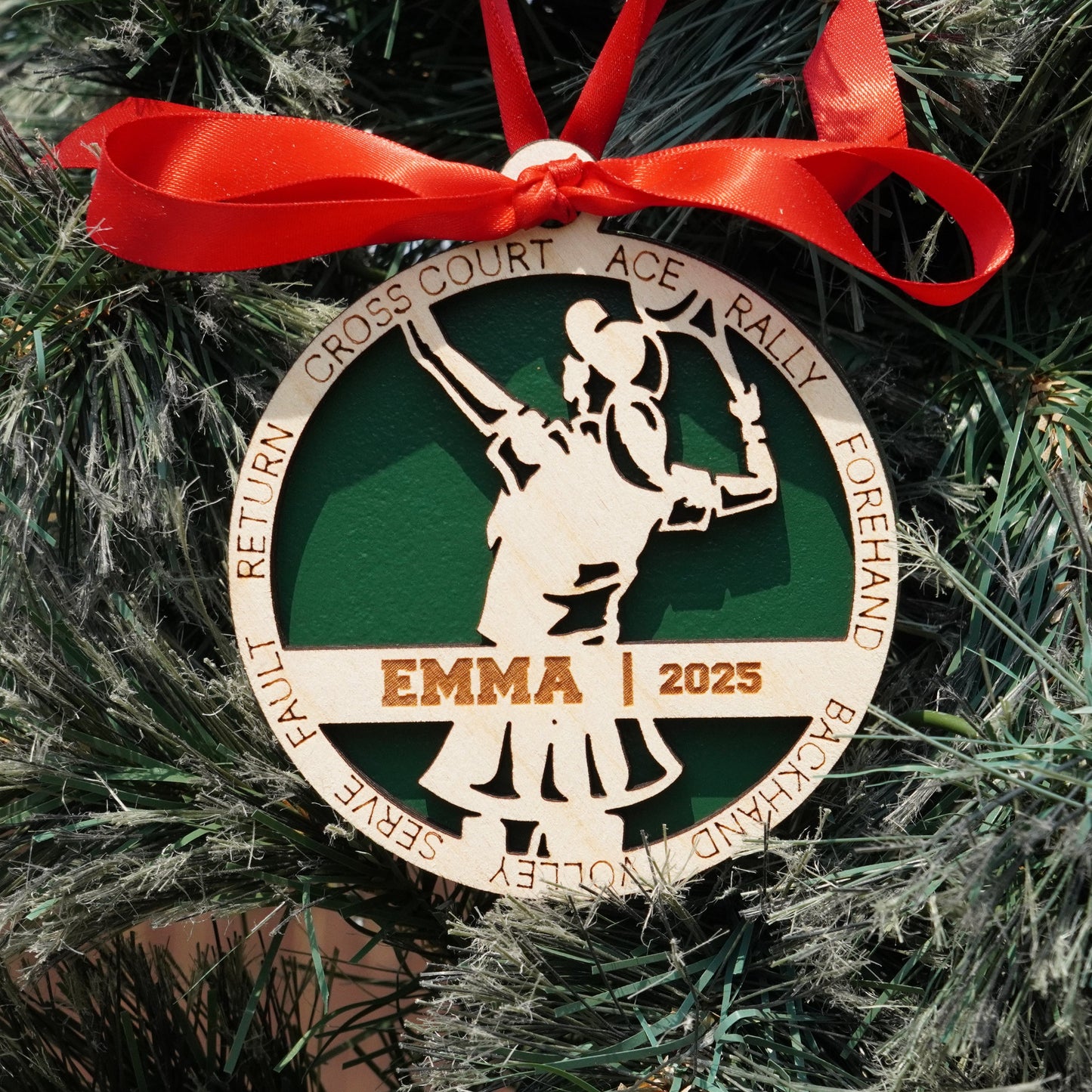 Decorative Christmas ornament with a red ribbon on a tree