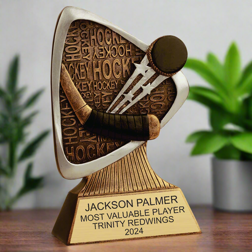 Angled side view of the detailed hockey trophy with an antique gold and silver finish, ideal for tournament awards and sports achievement displays.