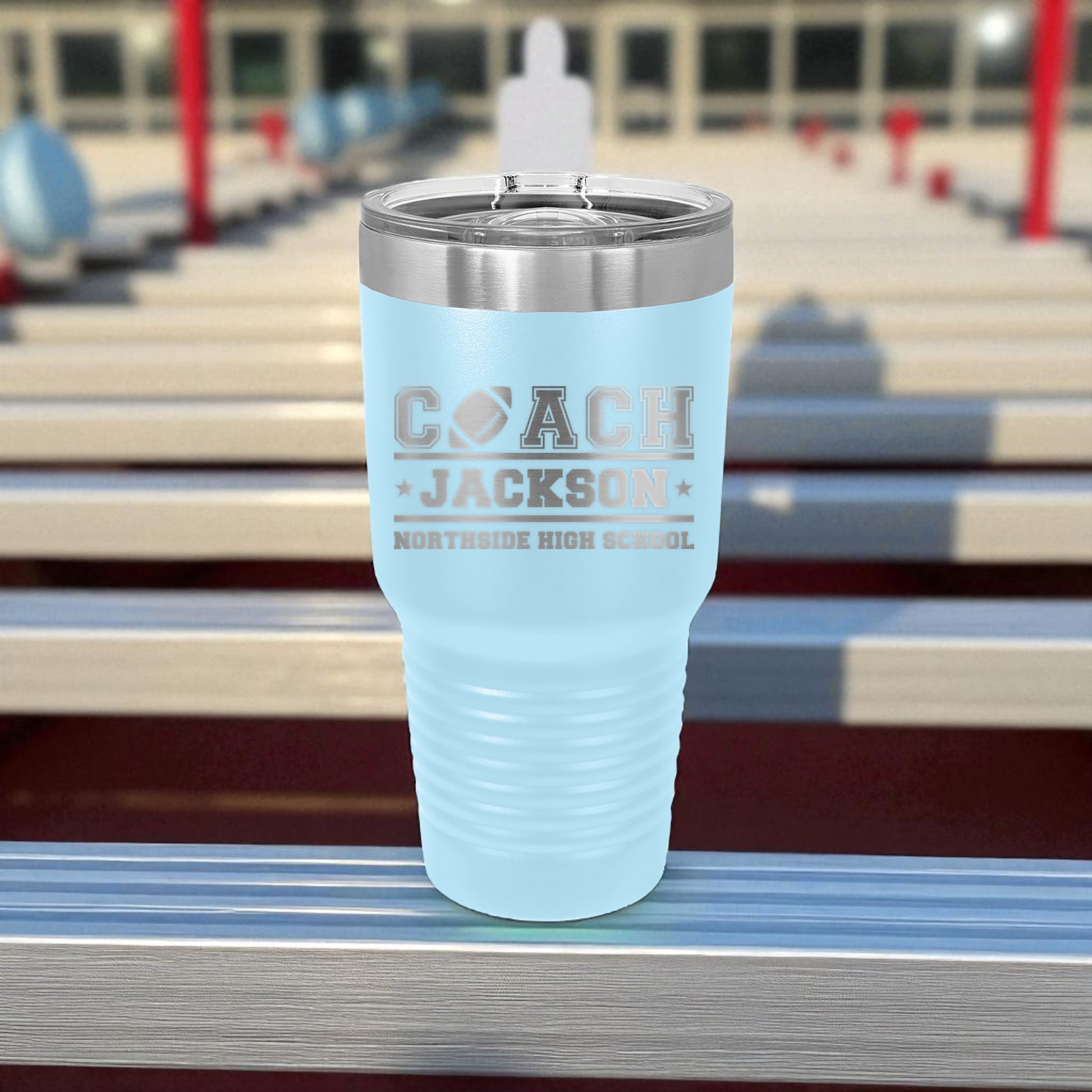 Light blue tumbler with 'Coach Jackson' and 'Northside High School' text on a stadium background