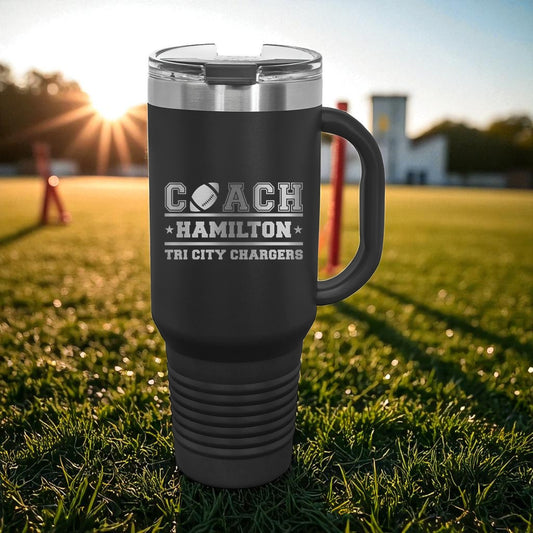 Black travel mug with 'Coach Hamilton Tri City Chargers' text on a grassy field background