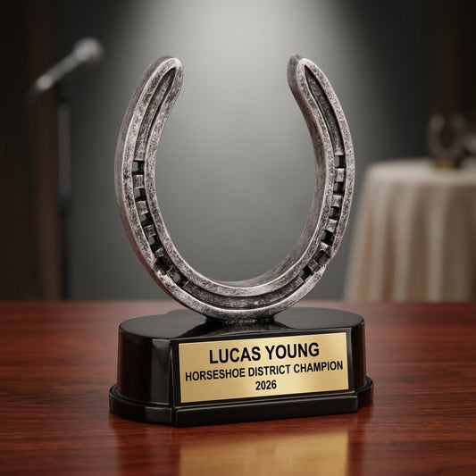 Horseshoe trophy specifications showing 5-inch height, gold finish, resin construction, and personalization options