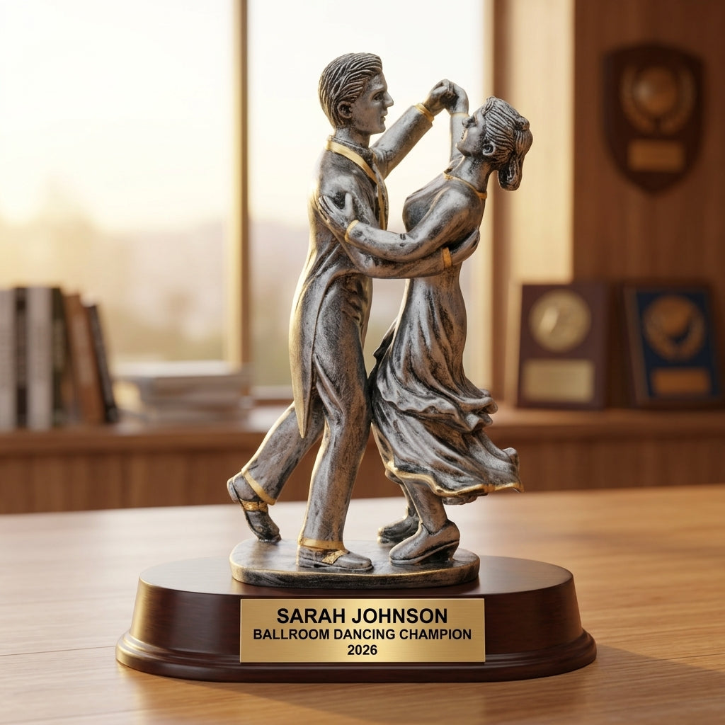 Close-up of laser-engraved gold nameplate on personalized ballroom dancing trophy showing custom name, achievement, and year