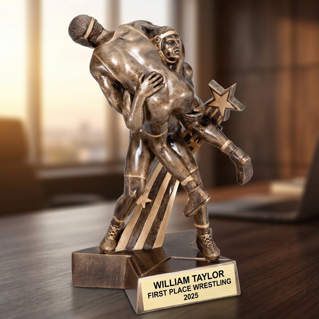 Close-up of laser-engraved gold nameplate on personalized wrestling trophy showing custom name, achievement, and year
