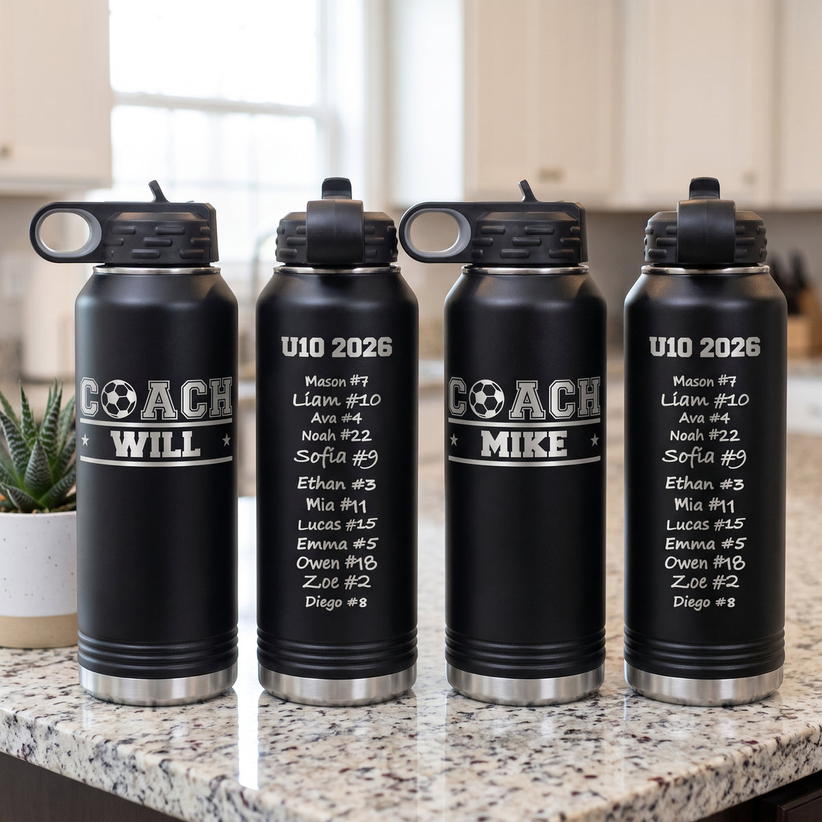 Set of four personalized soccer coach bottles on a kitchen counter showing the signed back and the COACH logo front
