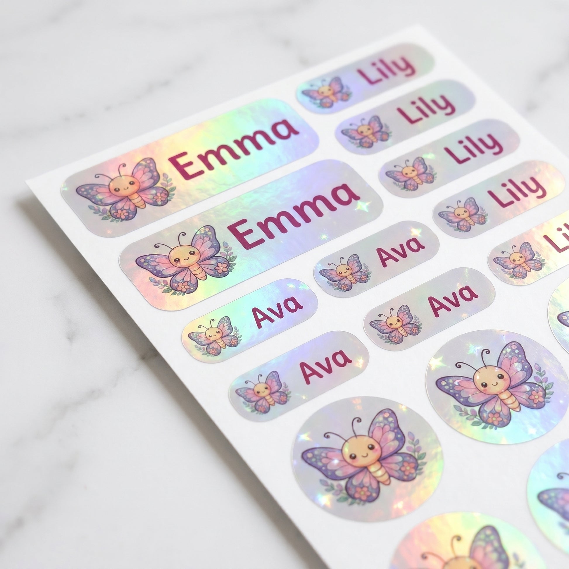 Holographic butterfly & floral name label sticker sheet close-up with rainbow shimmer