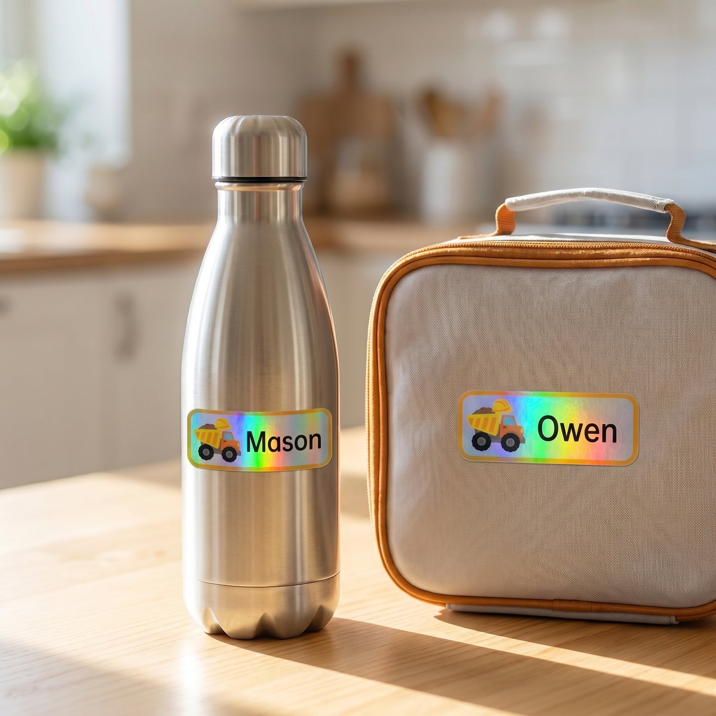 Personalized construction name labels on a kids water bottle and lunchbox
