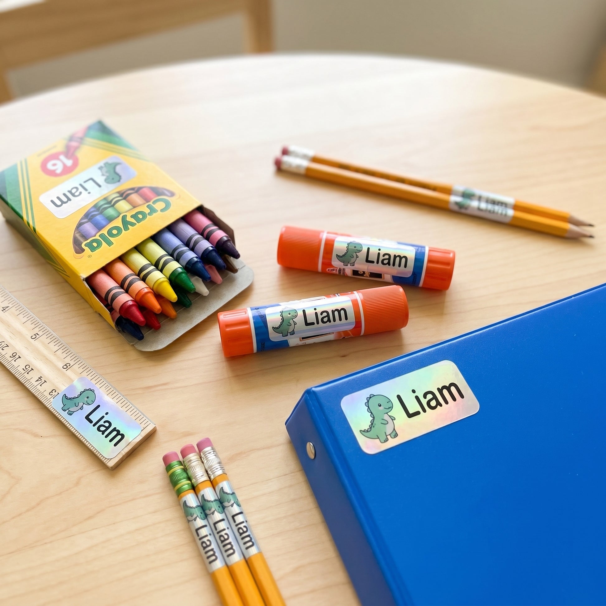 dinosaur name labels on school supplies - crayons, glue, ruler, pencils, binder