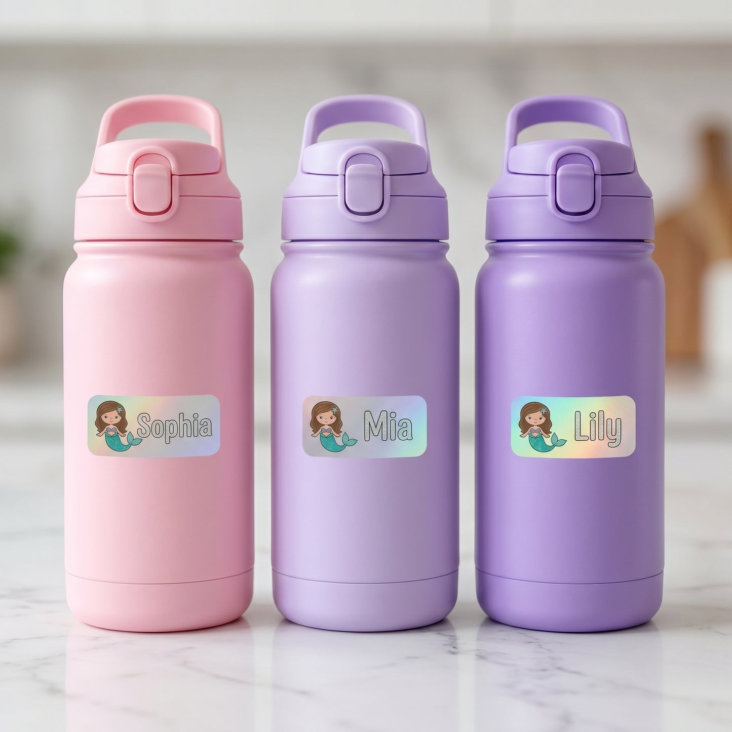 Personalized mermaid name labels on three kids water bottles