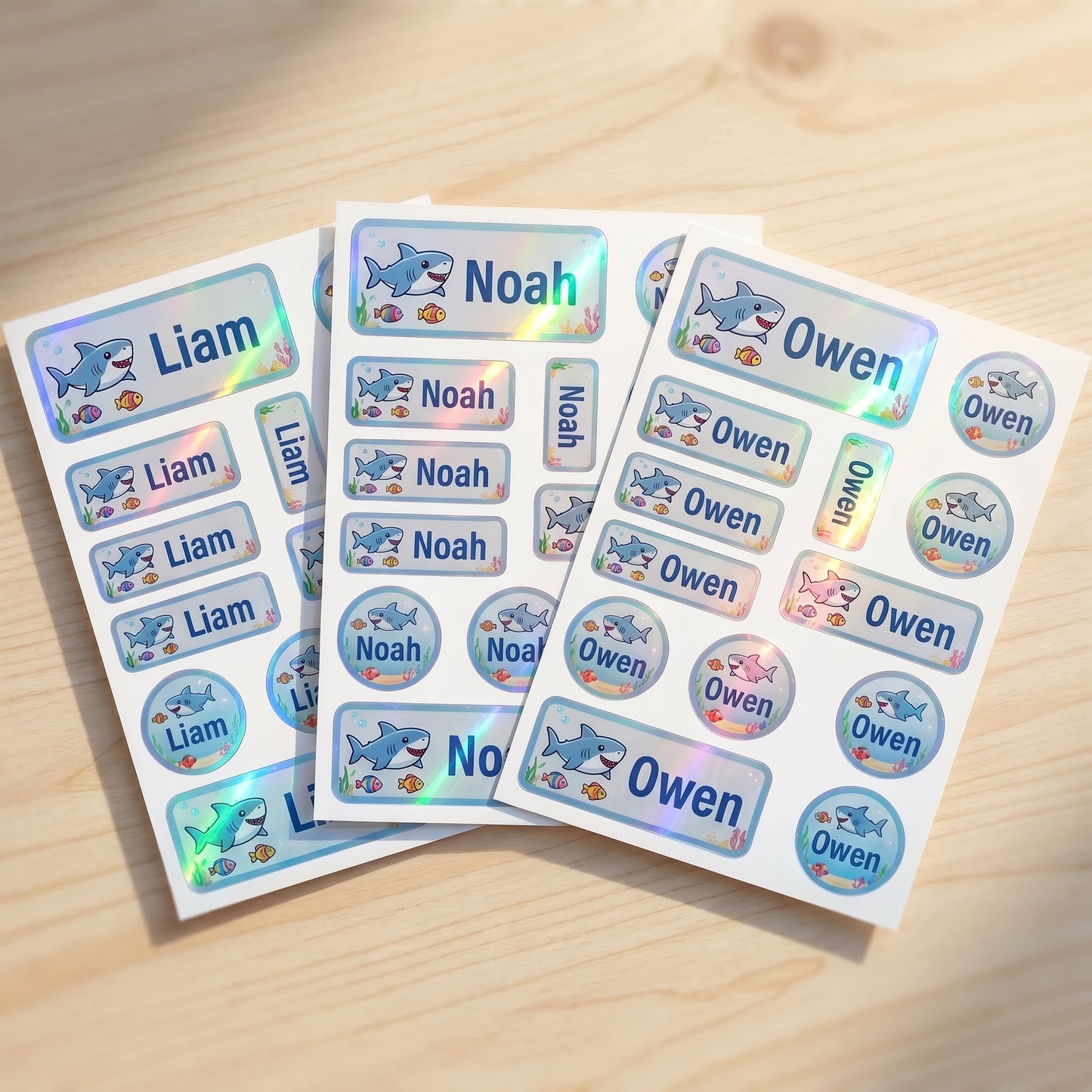 Holographic ocean & sharks name label sticker sheet close-up with rainbow shimmer
